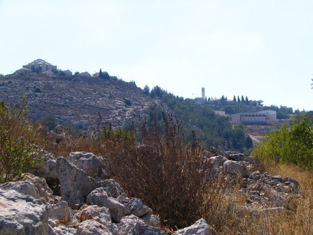 The modern illegal Israeli settlement looms over ancient Tel Shiloh.